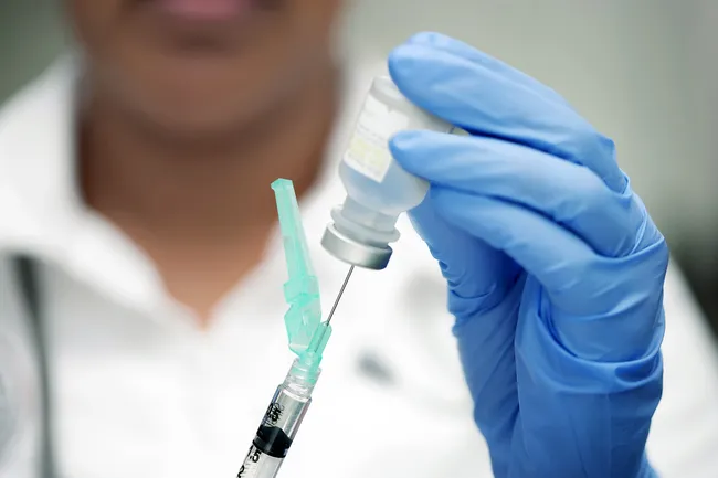 photo of syringe in vial
